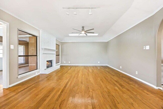 Building Photo - "Charming garden home offers 3-Bedroom Sanctuary with Cozy Fireplace in San Antonio – 1710 Sq Ft ...