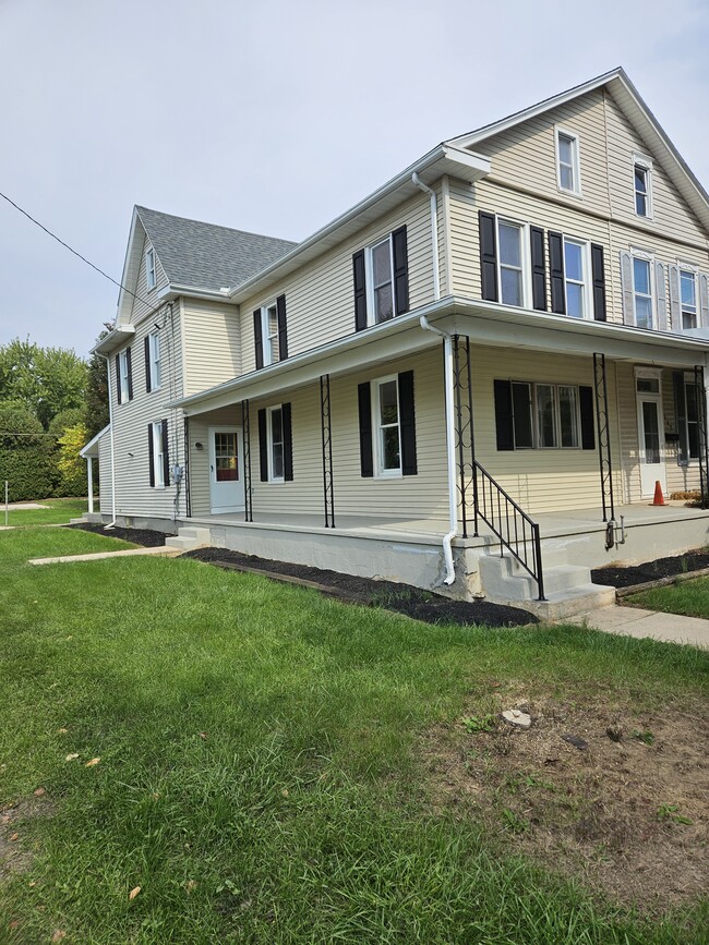 Side of house and side yard. Parking available on the alley and street. - 149 W Sheridan Ave