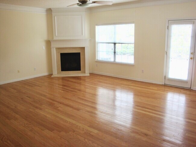 Great Room - hardwood floors, gas fireplace and natural light - 5662 Lawley Dr