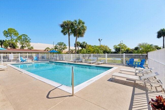 Pool Deck with Lounge Chairs - Cypress Place Apartments