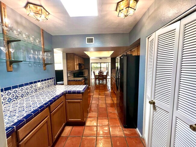 Fully stocked kitchen with pots, pans, dish ware, glass ware, and silver ware. - 5010 E South Regency Cir