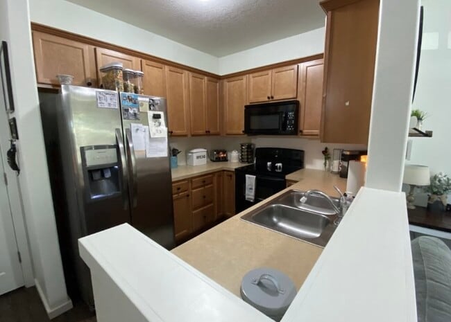 Kitchen with new stove & dishwasher. - 38438 Galway St