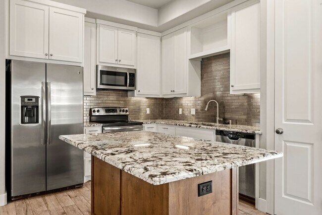 Building Photo - Like New Condo Within Walking Distance to ...