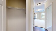Located at 5000 Stein Dr in Cranberry Township, PA, this two-bedroom, two-bathroom single-floor residence offers a thoughtfully designed layout with a comfortable and functional living environment. The open living area features warm neutral tones, plush carpeting, crown molding, and large windows that invite generous natural light and outdoor views, creating a bright and welcoming atmosphere.

The kitchen is well-equipped with rich dark cabinetry, granite-style countertops, stainless steel appliances including a range, microwave, and dishwasher, and a double basin sink beneath a window overlooking the outdoors. The hardwood-style flooring adds a polished, modern contrast to the cabinetry.

The primary bedroom is a spacious retreat featuring carpeted floors, large windows, and access to a private en-suite bathroom with dark vanity cabinetry, a white countertop, and a walk-in closet with built-in wire shelving. The second bedroom also offers ample space, natural light, and a double bi-fold closet. The second full bathroom includes a tub-shower combination and matching dark vanity.

A dedicated in-unit laundry area with stacked washer and dryer hookups adds everyday convenience. Throughout the residence, consistent warm beige walls, crisp white trim, and a cohesive design palette contribute to a clean, move-in-ready aesthetic.