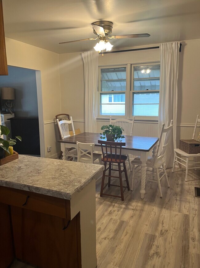 Dining area. Shows new countertops and flooring - 65 Woodcrest Dr