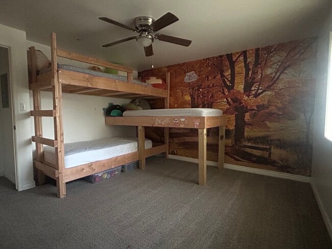 SE bdrm. Beautiful fall wallpaper. Double closet. Ceiling fan. - 3780 W Montana St