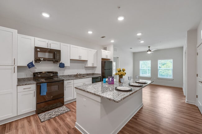 Kitchen with view of living room in the back - Anthem III