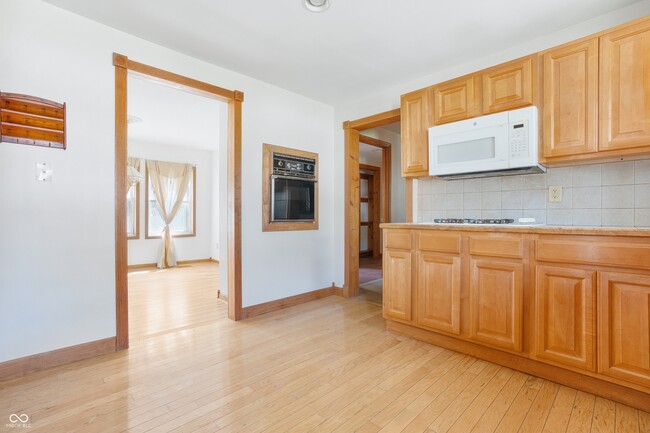 Kitchen area with living room area. - 127 W Southern Ave