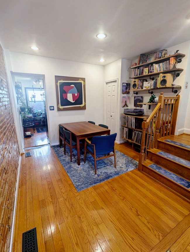 Dining room looking into kitchen. Shelving unit not included. - 1138 Day St