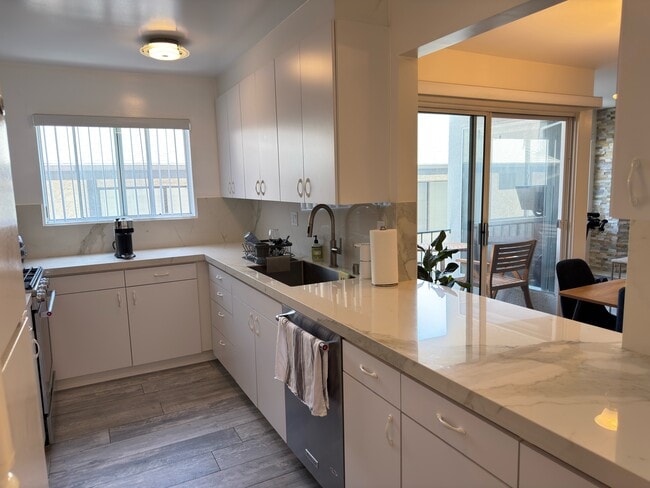 KITCHEN LARGE LOOK THROUGH TO LIVING AREA - Large Bright Front Remolded 2x2 Unit
