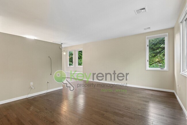 Building Photo - Spacious 2BR/2BA Duplex in Gated Community with Parking, Washer/Dryer & NYC Skyline Views