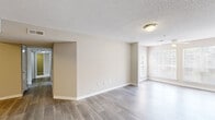 Located at 925 Gresham Ave NE in Marietta, GA, this well-appointed 2-bedroom, 2-bathroom single-floor residence offers a functional and comfortable layout. The open living room is bright and welcoming, featuring wood-look flooring, neutral beige walls, textured ceilings, and large windows that invite generous natural light. A ceiling fan adds comfort to the living area, which flows seamlessly toward the kitchen pass-through.

The galley-style kitchen is efficiently designed with white cabinetry, light countertops, a stainless steel refrigerator, stainless electric range, under-cabinet microwave, and a double sink — all complemented by easy-to-maintain hard surface flooring.

Both bedrooms are carpeted and offer a quiet, restful atmosphere. The primary bedroom is a well-proportioned retreat featuring a ceiling fan, a window with outdoor views, and closet storage with built-in shelving. The secondary bedroom is similarly finished with neutral tones and plush carpeting.

Each of the two bathrooms includes a tub/shower combination with clean white surrounds and chrome fixtures. The overall color palette throughout the home is soft and neutral, creating a cohesive, move-in ready feel across every room.