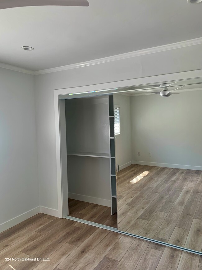 Large Mirrored Closet Doors - 324 N Oakhurst Dr