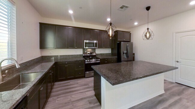 Building Photo - PRICE REDUCTION! Beautiful 4 Bedroom 3 Bat...