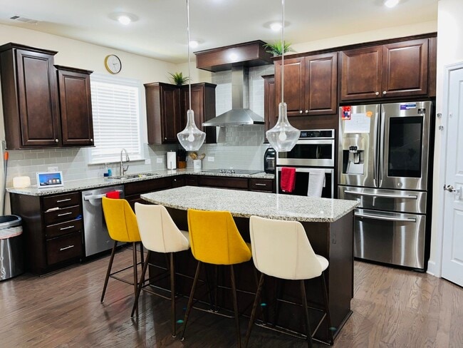 Building Photo - WOW! Prime PTC location! 3 car garage, har...