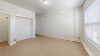 Located at 621 South Union Avenue in the Westlake neighborhood of Los Angeles, this compact single-floor unit offers two bedrooms, one bathroom, a kitchen, and a dedicated closet within a efficiently arranged floor plan. The generously sized primary bedroom occupies a significant portion of the unit and features neutral-toned carpet flooring, bright white walls, a wall heater, and a window fitted with horizontal blinds that allows natural light to filter in. The second bedroom is similarly finished with carpeted floors and clean white walls, offering a versatile space suitable for a variety of uses. The kitchen is equipped with a gas range and granite-style countertops, complemented by tile flooring and a large window with blinds that brings in outdoor light and views of surrounding greenery. The bathroom features a full tub and shower combination with clean white tile surround and chrome fixtures, maintaining a simple and functional aesthetic throughout. A walk-in style closet with carpeted floors provides practical storage. The unit's consistent white palette, carpet in living areas, and tile in wet zones create a cohesive, clean look throughout. Situated near Downtown Los Angeles, this unit offers convenient access to major transit routes and urban amenities.