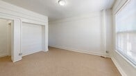 Located at 621 South Union Avenue in the Westlake neighborhood of Los Angeles, this compact single-floor unit offers two bedrooms, one bathroom, a kitchen, and a dedicated closet within a efficiently arranged floor plan. The generously sized primary bedroom occupies a significant portion of the unit and features neutral-toned carpet flooring, bright white walls, a wall heater, and a window fitted with horizontal blinds that allows natural light to filter in. The second bedroom is similarly finished with carpeted floors and clean white walls, offering a versatile space suitable for a variety of uses. The kitchen is equipped with a gas range and granite-style countertops, complemented by tile flooring and a large window with blinds that brings in outdoor light and views of surrounding greenery. The bathroom features a full tub and shower combination with clean white tile surround and chrome fixtures, maintaining a simple and functional aesthetic throughout. A walk-in style closet with carpeted floors provides practical storage. The unit's consistent white palette, carpet in living areas, and tile in wet zones create a cohesive, clean look throughout. Situated near Downtown Los Angeles, this unit offers convenient access to major transit routes and urban amenities.