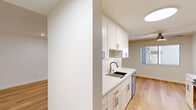 Located at 2721 Midtown Ct in Palo Alto, CA, this thoughtfully updated single-floor residence offers a clean, modern aesthetic throughout. Light wood flooring runs continuously across all rooms, creating a cohesive and airy feel that complements the crisp white walls and recessed lighting found throughout the home.

The open living room is a standout space, bathed in natural light from large sliding glass doors that lead directly to a private outdoor deck — perfect for enjoying the California climate. A secondary window further brightens the area, enhancing the sense of openness.

The galley-style kitchen is well-appointed with white shaker cabinetry, white quartz countertops, a stainless steel sink, and a full suite of stainless steel appliances including a refrigerator, electric range, over-the-range microwave, and dishwasher. A skylight-style ceiling fixture provides bright, even illumination.

The bedroom is a comfortable and well-proportioned retreat featuring a ceiling fan, natural light from a window with garden views, and a mirrored sliding-door closet. The clean, neutral palette makes the space feel welcoming and versatile.

The bathroom is finished with white subway tile surrounding a full soaking tub and shower combination, with brushed nickel fixtures adding a refined touch. The overall design of this Palo Alto residence is clean, functional, and move-in ready.