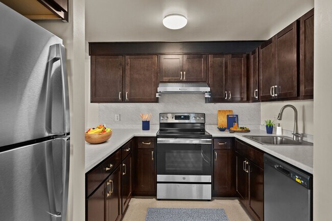 Modern kitchens with ample cabinet space at Mission Main. - Mission Main