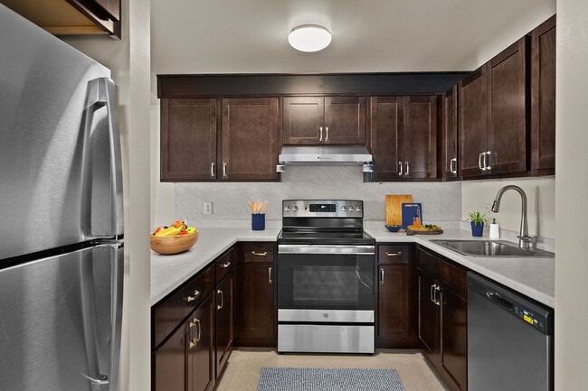 Modern kitchens with ample cabinet space at Mission Main. - Mission Main