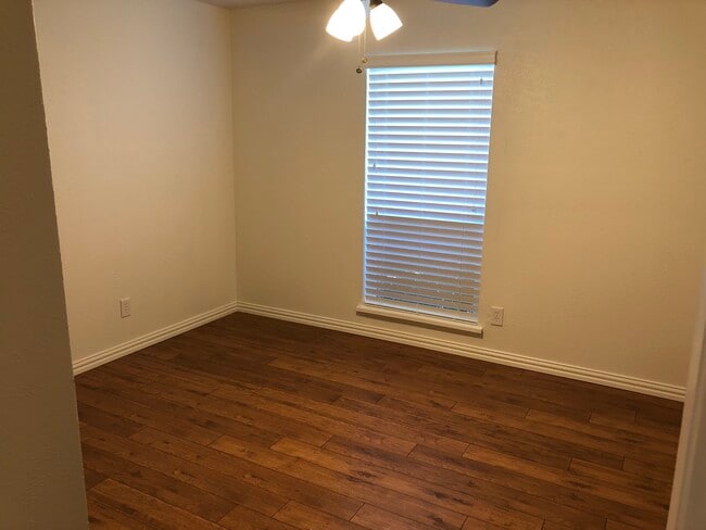 Bedroom two that is a little larger than the first room. - 745 Meadow Mead Dr