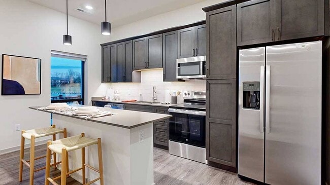 Enjoy a full kitchen setup ready for cooking or reheating. - Brynwood at Wilderness Ridge
