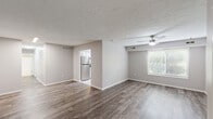 Located at 1361 Fox Run Dr in Willoughby, Ohio, this single-floor, 2-bedroom, 1-bathroom home offers a thoughtfully laid-out living space designed for comfort and functionality. The open-concept living and dining area is finished with durable wood-style plank flooring, neutral gray walls, and a textured ceiling. A ceiling fan with light fixture keeps the space comfortable, while a window allows natural light to flow in. The living and dining areas connect seamlessly, with a clear sightline into the kitchen. The kitchen features white cabinetry, granite-look countertops, a stainless steel dishwasher and refrigerator, a single-basin sink, and light ceramic tile flooring — all complemented by a window overlooking the outdoors. Both bedrooms are carpeted and finished in soft, neutral tones, each offering natural light through blinds-fitted windows and generous closet space with sliding doors. The primary bedroom provides a comfortable, spacious retreat. Throughout the home, five closets offer exceptional storage capacity, and a dedicated laundry area and utility room add further practicality. A hallway connects the private areas of the home, and the entrance provides a welcoming transition into the living space.