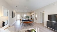 Located at 7711 Longmire Rd in Conroe, TX, this thoughtfully designed single-story home offers 2 bedrooms, 4 bathrooms, a dedicated office, and a full laundry room within a well-appointed, efficient floor plan. The open-concept living, dining, and kitchen area forms the heart of the home, featuring light wood-look flooring, recessed lighting, and a ceiling fan that contribute to a bright, airy atmosphere. The kitchen is outfitted with white shaker-style cabinetry, dark granite countertops, a subway tile backsplash, stainless steel appliances, and pendant lighting above the island — a clean, modern aesthetic throughout. The living room receives generous natural light through large windows and offers a comfortable, well-proportioned space for relaxing or entertaining. The primary bedroom is a restful retreat with natural light and easy access to a bathroom featuring a white tiled soaking tub and matte black fixtures. Additional bathrooms mirror the home's consistent design language with granite vanities and light cabinetry. The dedicated office includes a large window with outdoor views, making it ideal for focused work. The laundry room accommodates full-size washer and dryer units. Every room reflects a cohesive, contemporary style with neutral tones and quality finishes throughout.