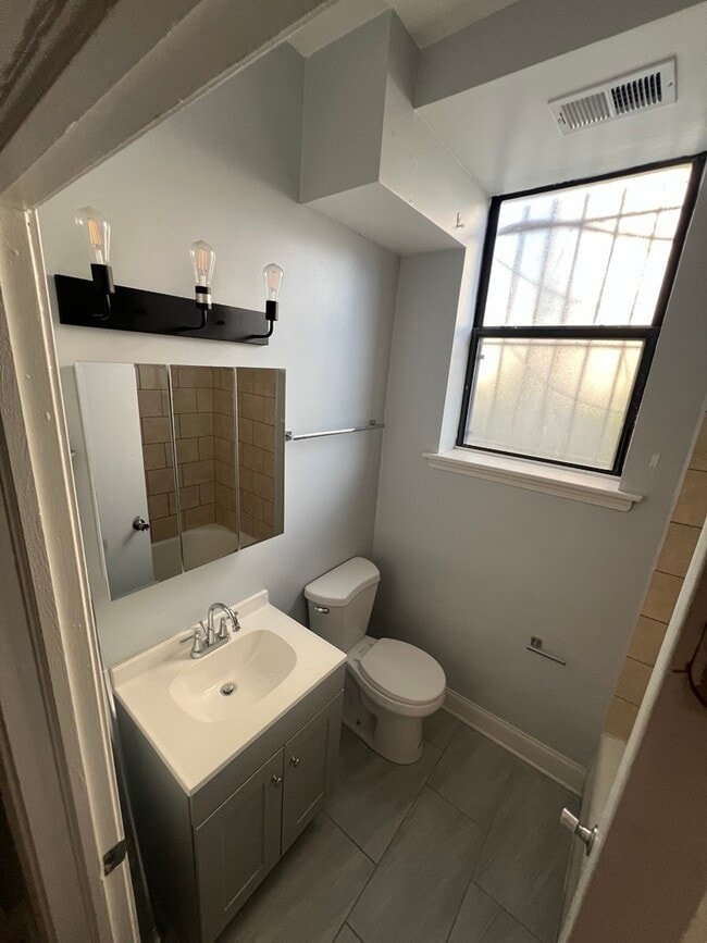 Unit 104 - 2358 E 70th Pl