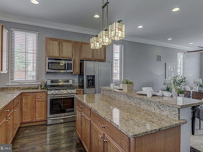 Building Photo - Beautiful EOG 3 bedroom  2.5 bath townhome with a 2 car garage and roof top deck overlooking the ...