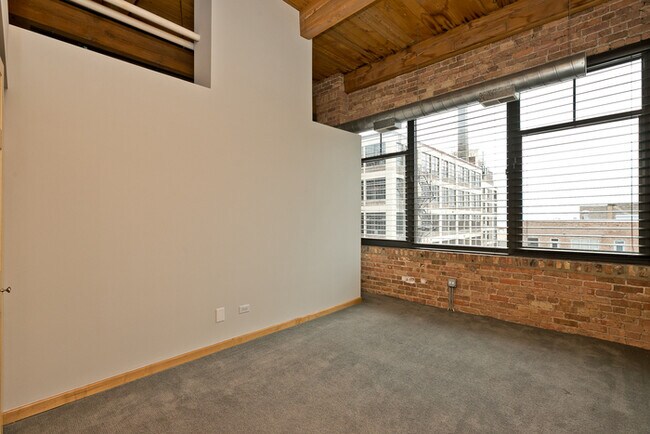Building Photo - This two bedroom, two bathroom brick expos...