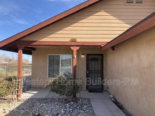 Building Photo - 6997-6949 49 Palms Ave