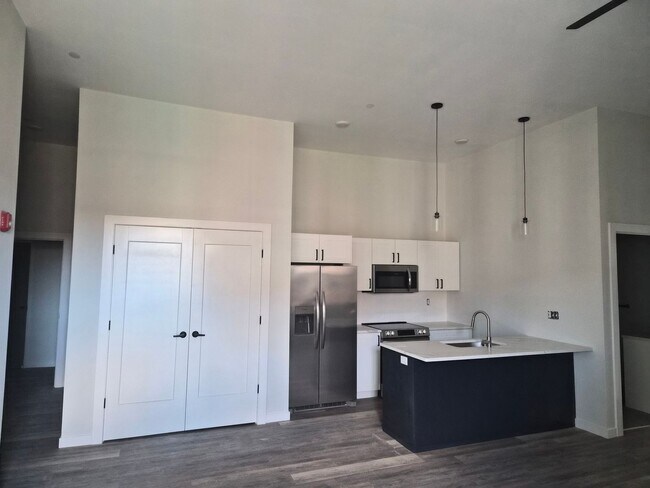 Building Photo - Downtown Claremont newly re-developed brick building with 2 Bed Luxury units, pet friendly!