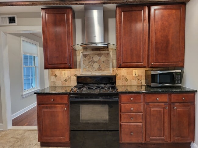 Stove and cabinetry - 731 N Stokes St