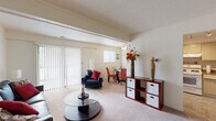 Located at 5220 Luzzane Dr in Indianapolis, Indiana, this single-floor, 2-bedroom, 1-bathroom home offers a well-organized layout designed for comfortable everyday living. The open living and dining area serves as the heart of the home, featuring neutral-toned carpet, a textured ceiling, and large sliding glass doors with vertical blinds that invite abundant natural light. Exposed ceiling beams add a subtle architectural detail to the shared living space.

The kitchen is functionally designed with light cabinetry, a double sink, white appliances including a range and dishwasher, and tile-style flooring — providing a clean and efficient workspace that connects easily to the rest of the home.

The primary bedroom is a generously proportioned retreat featuring dual sliding-door closets with mirrored panels, soft carpet, and a textured ceiling. The second bedroom also offers carpeted flooring, a natural light-filled window, and closet access. Both rooms maintain a calm, neutral palette throughout.

The full bathroom includes a tub-shower combination, a vanity with storage cabinetry, and tile flooring, offering a clean and practical design. Additional storage is provided by three closets and a dedicated utility room. A connecting hallway ties all rooms together in a cohesive, easy-to-navigate floor plan.