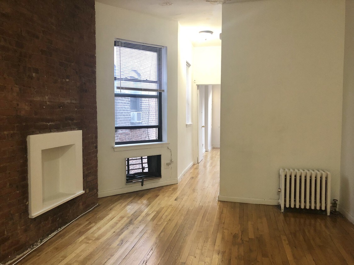 Living room and hallway to bedroom - 322 E 90th St