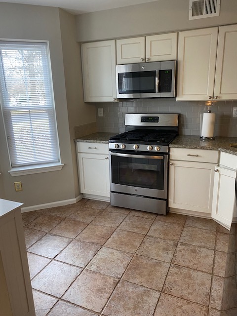 Kitchen showing oven+range. Over-the-range microwave not shown - 105 Hopkins Ct