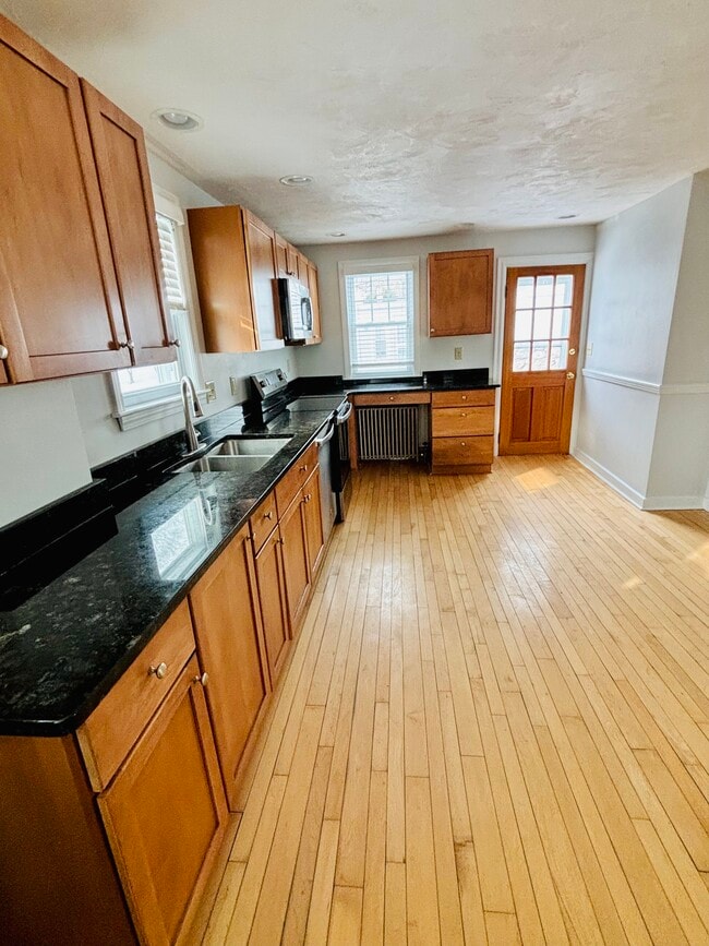 Updated kitchen with stainless steel appliances and garbage disposal - 11 Gifford Dr