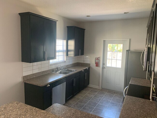 Building Photo - Remodeled three bedroom two bath home with...