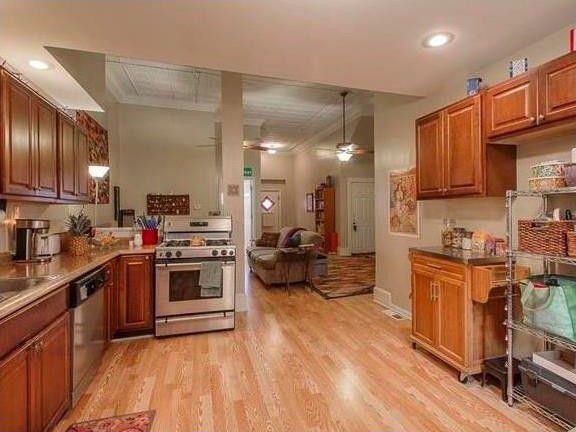 Kitchen with open view to living area. - 1137 W 41st St