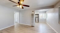 Located at 3949 Kansas Street in San Diego's vibrant North Park neighborhood, this 2-bedroom, 1-bathroom single-story home offers a well-designed layout with a clean, modern aesthetic. Light wood-style flooring runs throughout, complementing soft gray walls and crisp white trim to create a bright, cohesive feel across all rooms.

The open living area flows naturally into the kitchen, which is a standout feature of the home. Equipped with white shaker cabinetry, granite-style countertops, and a full suite of stainless steel appliances — including a gas range, dishwasher, and refrigerator — the kitchen is both functional and visually appealing.

Both bedrooms are comfortably proportioned, each featuring ceiling fans with integrated lighting and windows fitted with blinds that allow for natural light and privacy. The rooms offer a calm, neutral atmosphere with ample closet access — the home includes four closets in total, providing generous storage throughout.

The bathroom is finished with a white vanity, a tub-shower combination, and a window that brings in natural light. A connecting hallway ties the layout together efficiently.

The space maintains a consistently fresh and updated feel, making it a well-appointed home in one of San Diego's most walkable and sought-after neighborhoods.