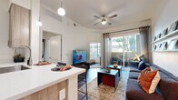 Located at 222 W Boston St in Chandler, AZ, this thoughtfully designed 2-bedroom, 1-bathroom residence offers a practical and contemporary layout across a single floor. The open-concept living and kitchen area forms the heart of the unit, where wood-style flooring, elevated ceilings, and a ceiling fan create a comfortable, airy atmosphere. A sliding glass door leads to a private balcony, allowing natural light to pour into the living space and providing outdoor views of the surrounding landscape.

The kitchen is efficiently appointed with stainless steel appliances — including a full-size refrigerator, electric range, and built-in microwave — complemented by light wood cabinetry and clean white countertops. A breakfast bar adds additional functionality to the space.

The primary bedroom is a well-proportioned retreat featuring a large window with outdoor views and ample natural light. The second bedroom offers similar brightness and comfort. A dedicated closet provides convenient storage, and the shared bathroom includes a full tub-shower combination, a wood-toned vanity with a white countertop, and wood-style flooring. A hallway connects the private areas of the unit seamlessly, completing this well-organized and modern Chandler residence.