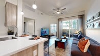 Located at 222 W Boston St in Chandler, AZ, this thoughtfully designed 2-bedroom, 1-bathroom residence offers a practical and contemporary layout across a single floor. The open-concept living and kitchen area forms the heart of the unit, where wood-style flooring, elevated ceilings, and a ceiling fan create a comfortable, airy atmosphere. A sliding glass door leads to a private balcony, allowing natural light to pour into the living space and providing outdoor views of the surrounding landscape.

The kitchen is efficiently appointed with stainless steel appliances — including a full-size refrigerator, electric range, and built-in microwave — complemented by light wood cabinetry and clean white countertops. A breakfast bar adds additional functionality to the space.

The primary bedroom is a well-proportioned retreat featuring a large window with outdoor views and ample natural light. The second bedroom offers similar brightness and comfort. A dedicated closet provides convenient storage, and the shared bathroom includes a full tub-shower combination, a wood-toned vanity with a white countertop, and wood-style flooring. A hallway connects the private areas of the unit seamlessly, completing this well-organized and modern Chandler residence.
