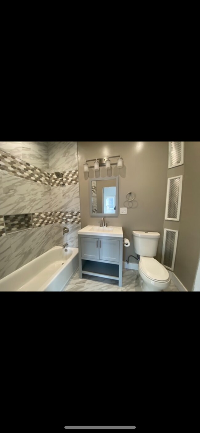 Spa inspired bathroom with 10 foot high ceiling - 1202 Rogers Ave