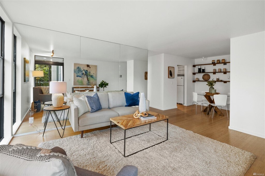 Full mirror wall floods the space with light from floor to ceiling windows - 730 Bellevue Ave E