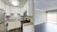 This upgraded 2-bedroom, 1-bathroom single-floor residence offers a well-appointed layout with modern finishes throughout. The kitchen has been thoughtfully renovated, showcasing crisp white shaker-style cabinetry with brushed nickel hardware, granite-look countertops, and a full suite of stainless steel appliances including a refrigerator, electric range, and over-the-range microwave. Dark hardwood-style flooring runs through the kitchen and living areas, adding warmth and a contemporary feel. The living room is spacious and open, featuring crown molding, a ceiling fan, and a sliding glass door that opens directly to a private patio with a fenced outdoor area — ideal for relaxing or entertaining. A dedicated bedroom features plush neutral carpeting, a bright window with natural light, and ample wall space. The bathroom is clean and functional, equipped with a full soaking tub and shower combo with white surround panels and brushed nickel fixtures. Textured ceilings are present throughout, complemented by crisp white trim and a neutral gray color palette that gives the home a cohesive, modern aesthetic. This upgraded unit balances comfort and practicality in a single-level layout.