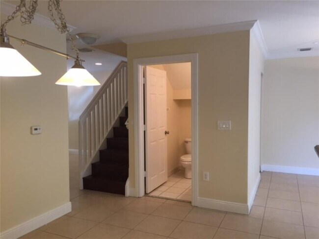 Open Floor Plan-Living/Front room, Stairway, Downstairs Half-Bath, Dining Room, Family/Back Room - 6621 SW 49th Ct