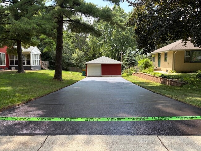Large driveway with one stall garage and ample storage - 6603 34th Ave N
