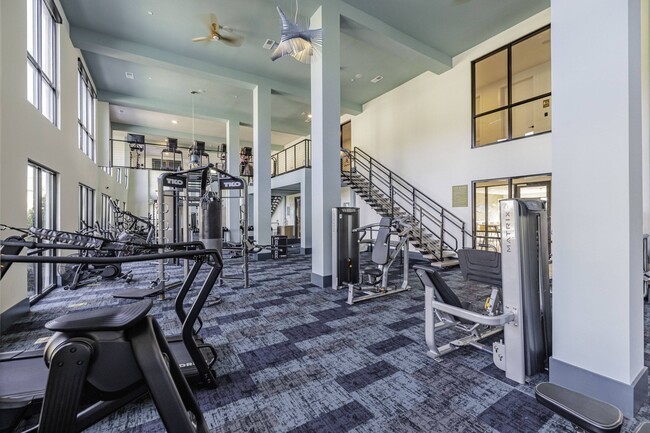 Two-Story Fitness Center with Cardio, Resistance & Free Weights - Forena Luxury Living