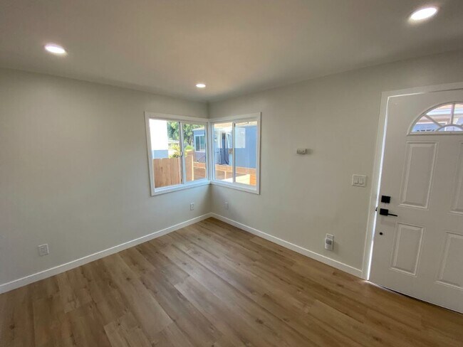 Building Photo - One-Bedroom, One-Bath - Brand New / Washer/Dryer / Fenced-In Yard - $2,295